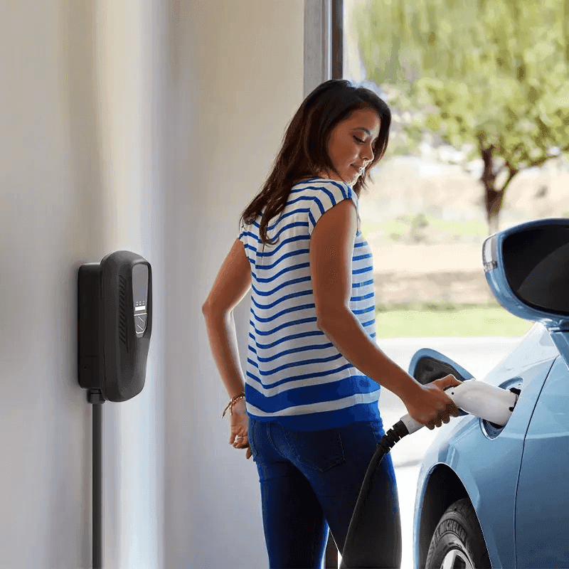 woman charging electric car